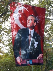 Ataturk on the Turkish flag, flying high and proud.